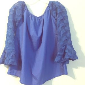 Dressy blouse, off the shoulders. Long sleeved.